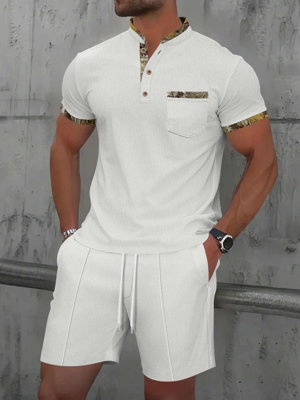 Man wearing a grey short sleeve zippered polo top and matching shorts, a casual cotton blend suit set.