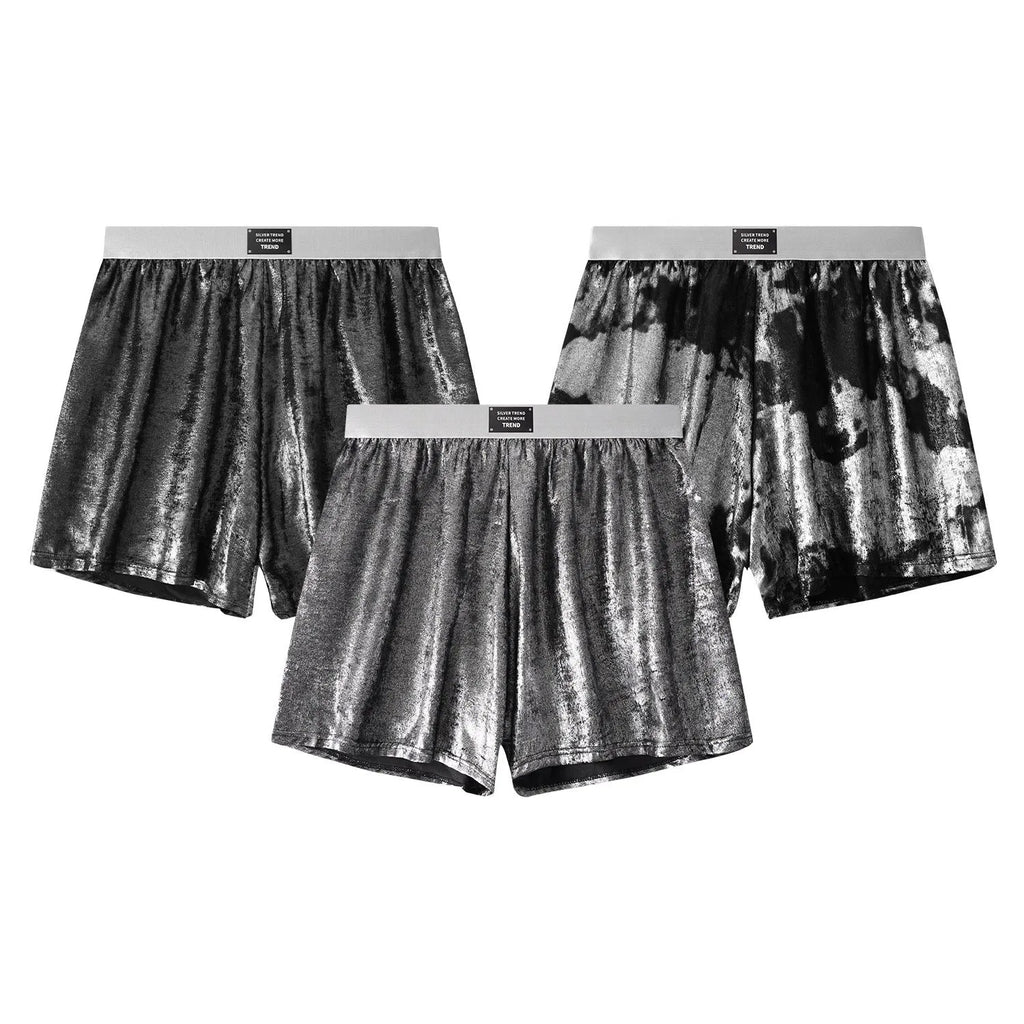 Men's bright silver woven underwear with reflective galaxy pattern showing loose fit mid-waist design