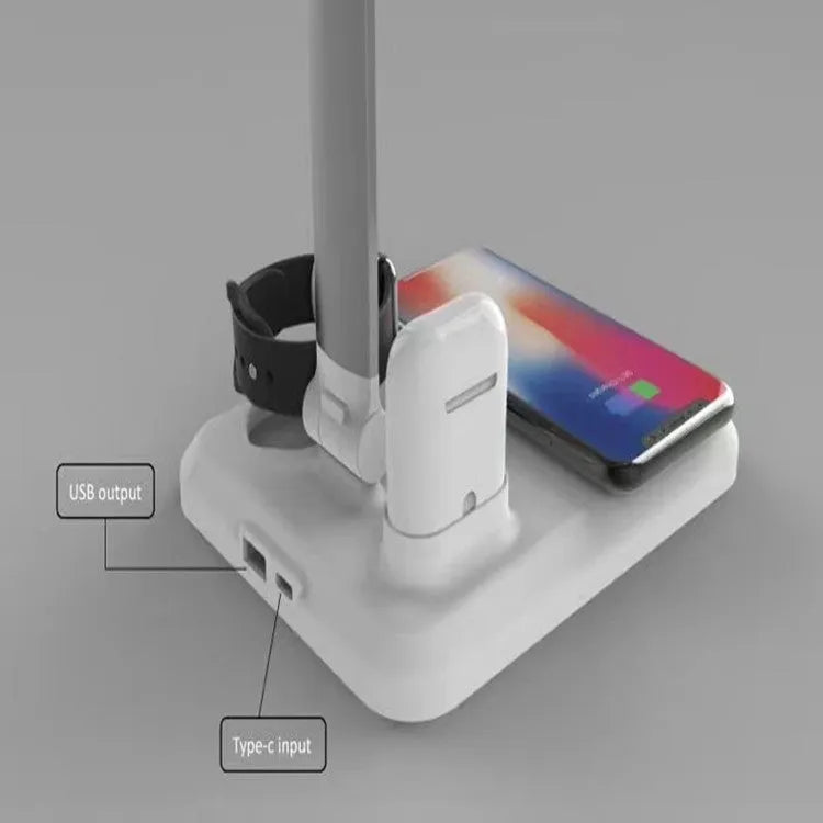 Black and white 4-in-1 LED desk lamp with wireless charging pad and adjustable lighting arm