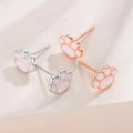 Handmade 925 silver cat paw ear studs in white gold colour finish on a white surface