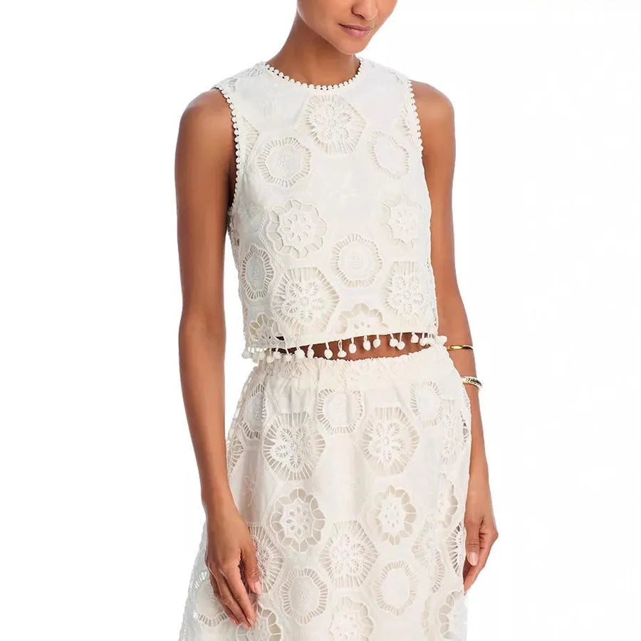 White women's retro style suit set with sleeveless top and embroidered long skirt