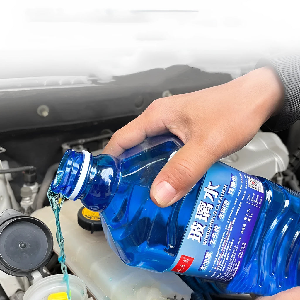 Blue 1L windshield washer fluid bottle with 0°C label for car windscreen cleaning