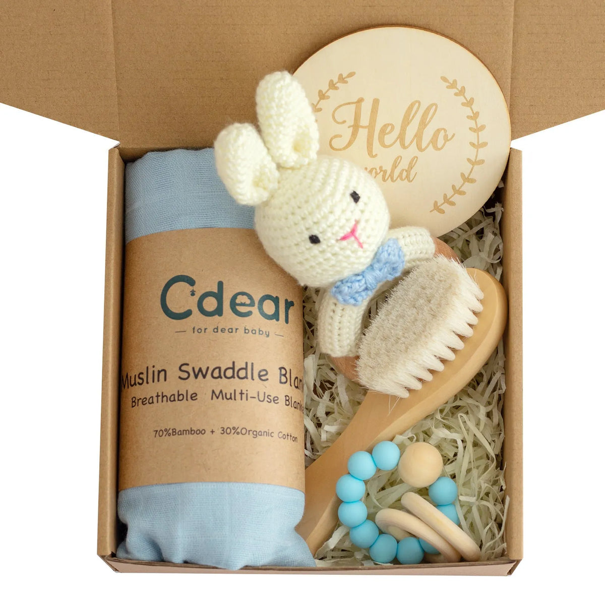 Baby teething toy gift set with bamboo blend gauze blanket, wooden beech bell, teether, brush, and milestone marker.
