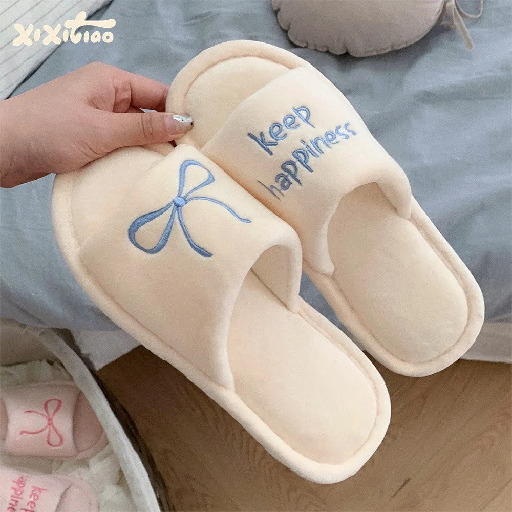 Ladies cotton slippers with letter pattern, bow, suede upper and flat non-slip PVC sole in beige yellow, pink or black