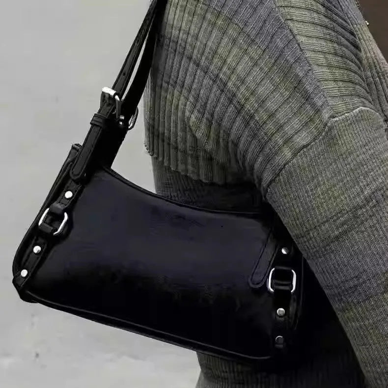 Black PU shoulder bag with horizontal square shape, outer three-dimensional pocket, and internal zipper change bag.