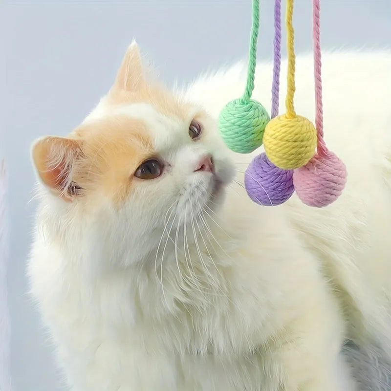 Colourful cat toy ball with attached rope, internal bell makes sound when rolled