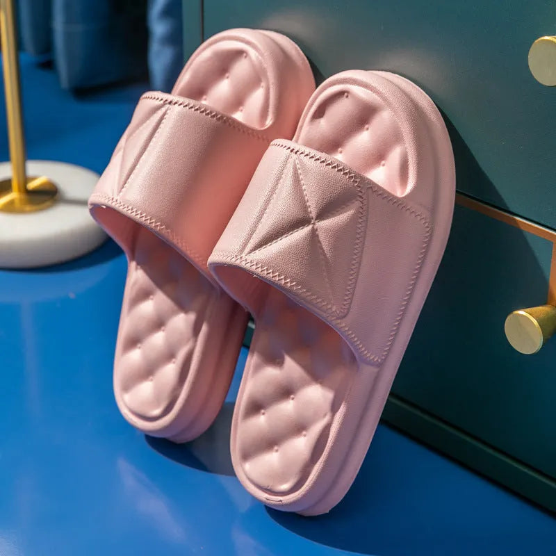 Pair of soft EVA bathroom slippers with a thick non-slip sole, shown in a selection of colours.