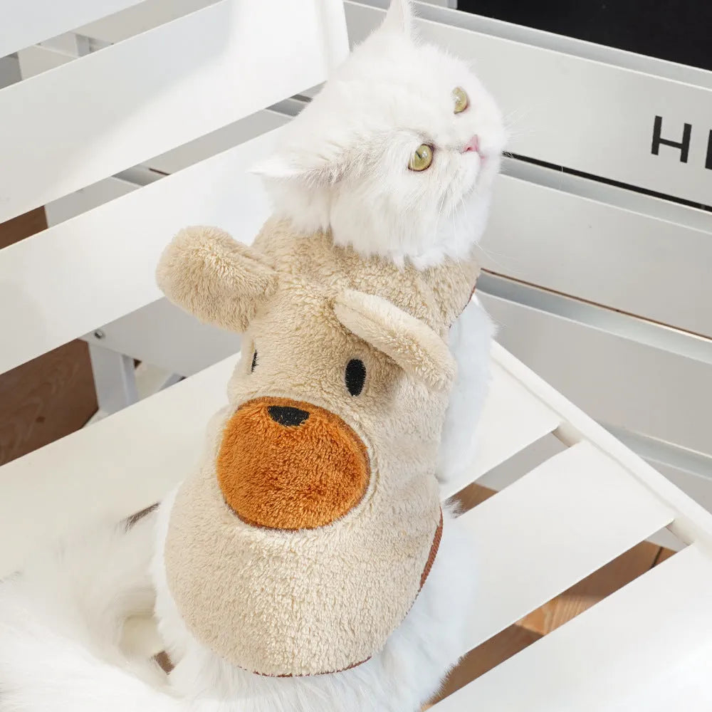 Fleece-lined warm dog clothes in cream with brown bear ears on a small dog