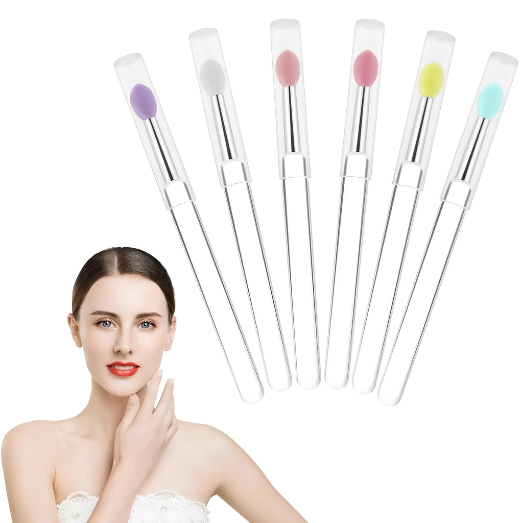 Set of four reusable silicone lip brushes with caps in assorted colours.