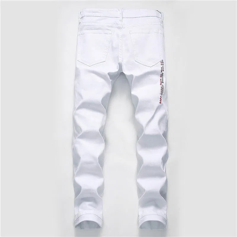 White shredded embroidery jeans in cotton denim, sizes 29-38, with ripped and embroidered details.