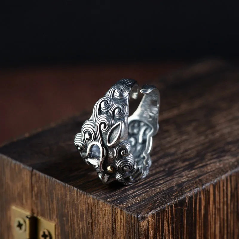 Silver open style ring showing Domineering Jibeast pattern with zodiac animal modelling