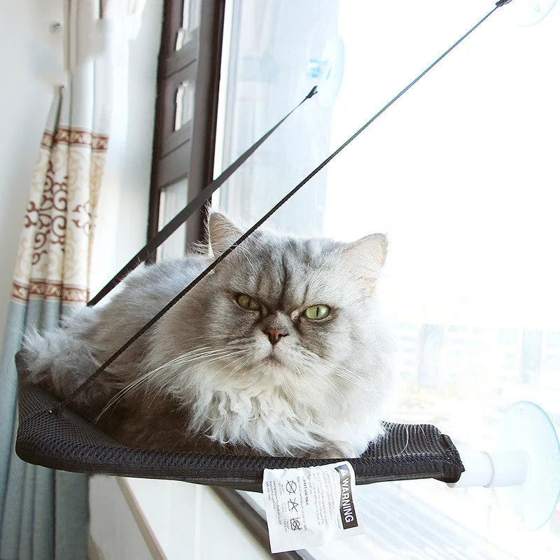 Black pet hammock with suction cups attached to a window, 53x32 cm, breathable mesh fabric
