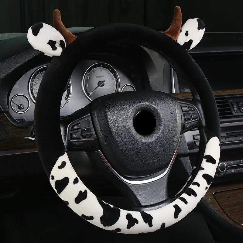 Short plush car steering wheel cover in black colour showing 38cm diameter measurement