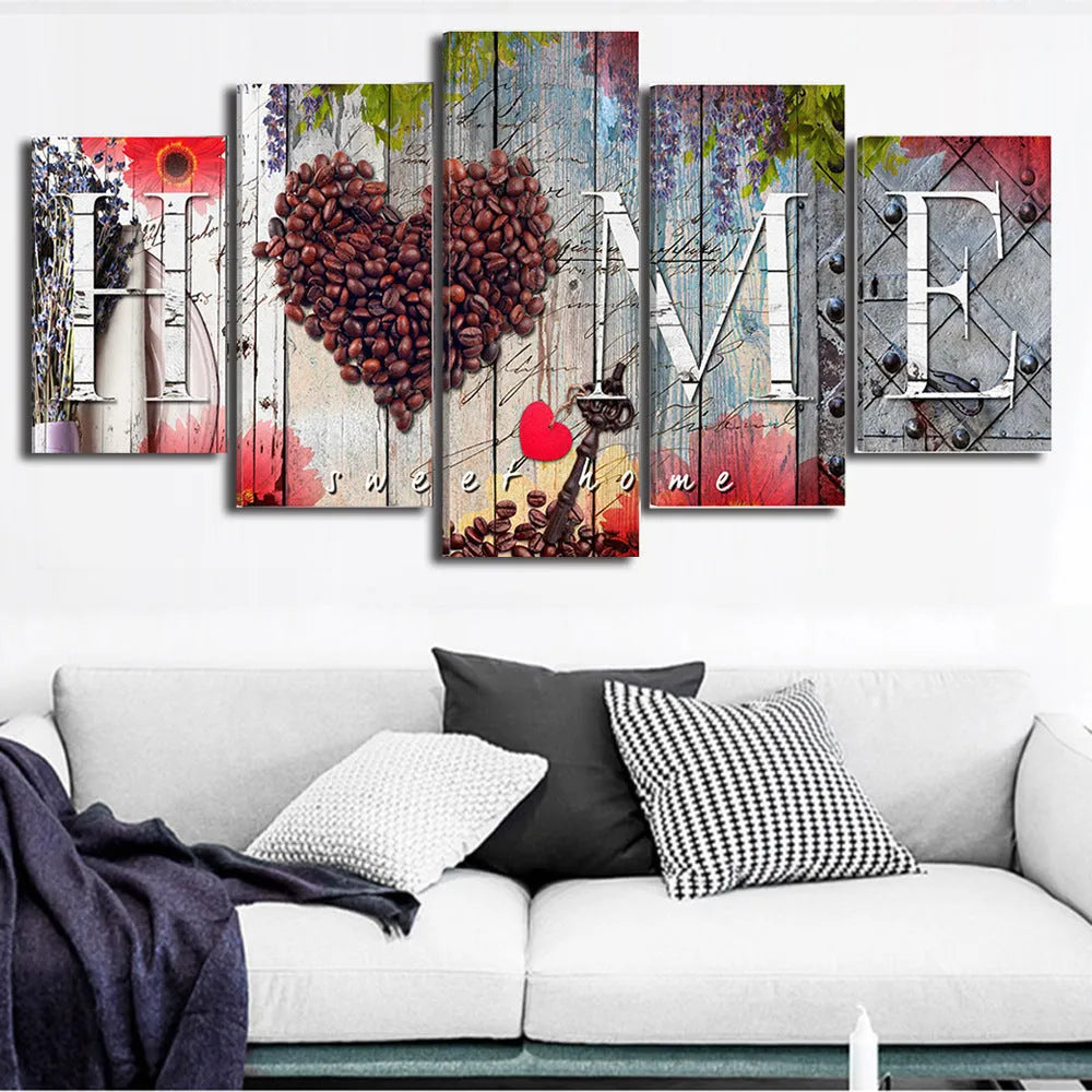 Set of five red unframed canvas wall art prints in graduated sizes arranged on a wall.