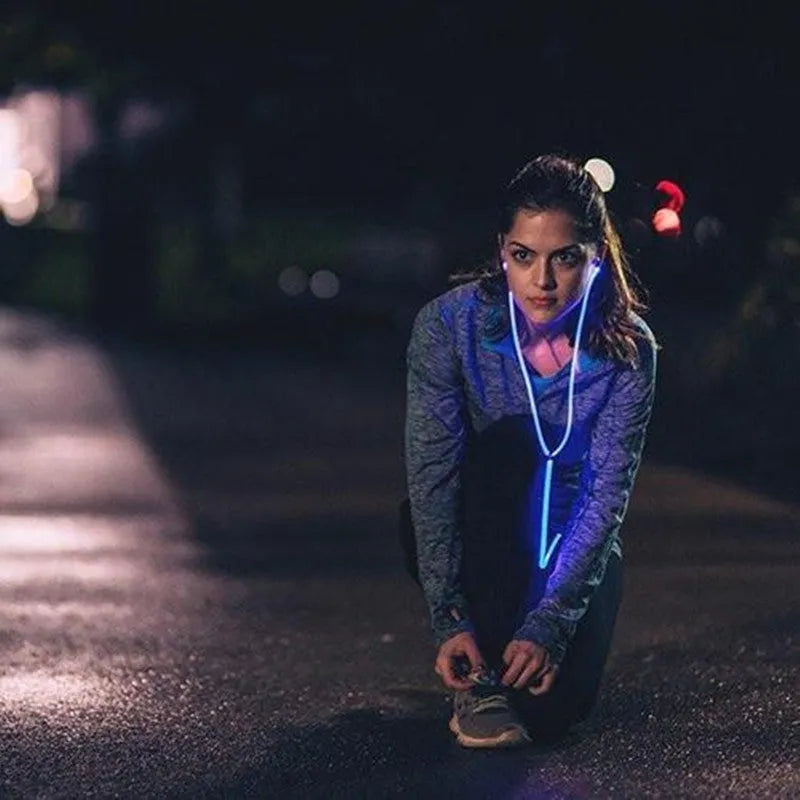 Blue LED light-up earphones with 3.5mm jack, compatible with iPhones, showing illuminated earpieces.