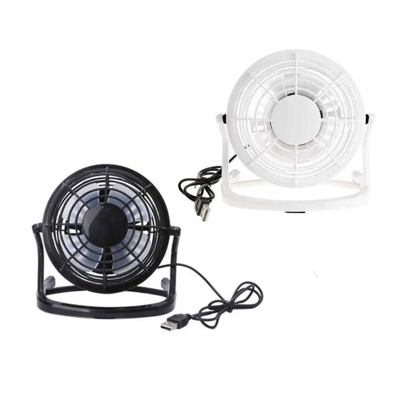 Small black USB desk fan with adjustable head and key switch on a wooden desk.