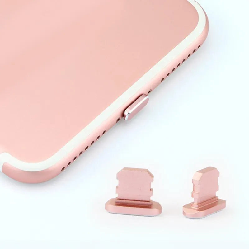 Aluminium alloy iPhone charging port dust plug in various colours including gold, silver, blue, and rose gold.