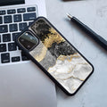 Marbled plastic back cover phone case for iPhone in blue gold and black gold colour options.