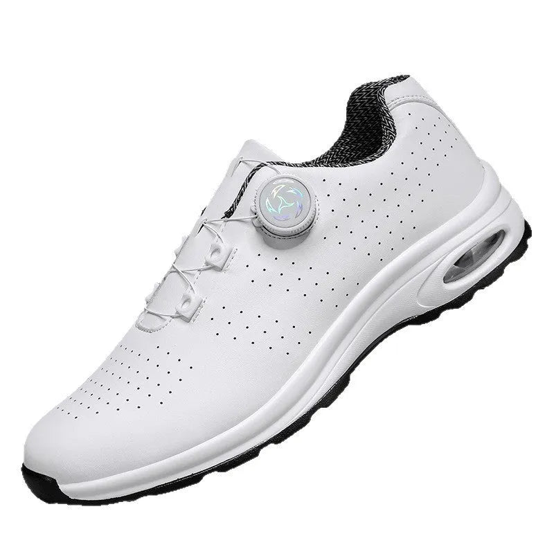 Black and white low top casual tennis shoes with mesh upper, cross shoulder straps, and composite sole.