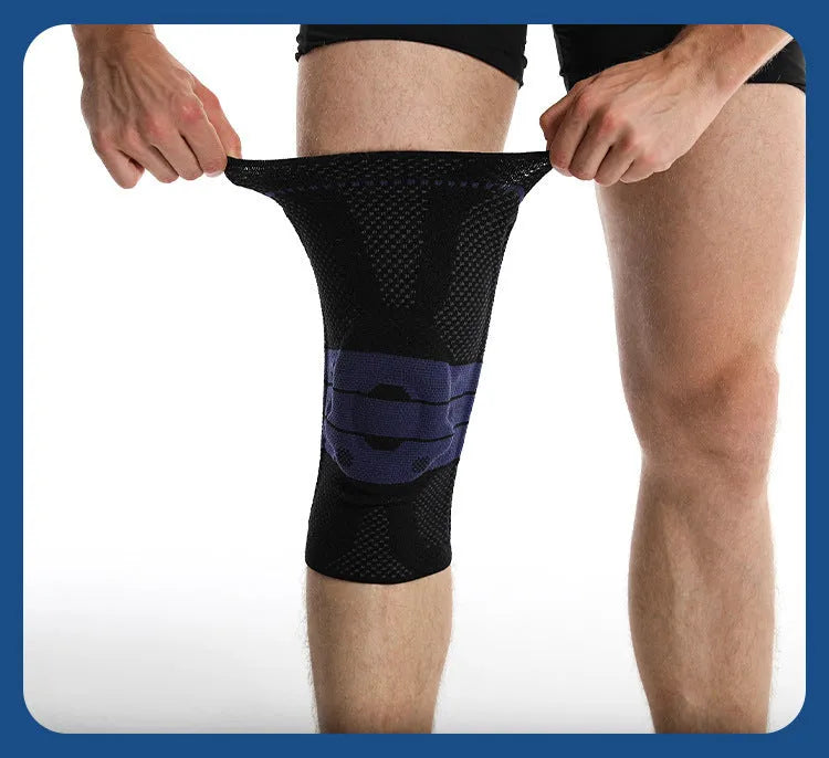 Adult black and blue sports knee pad made of nylon and spandex, shown on a knee.