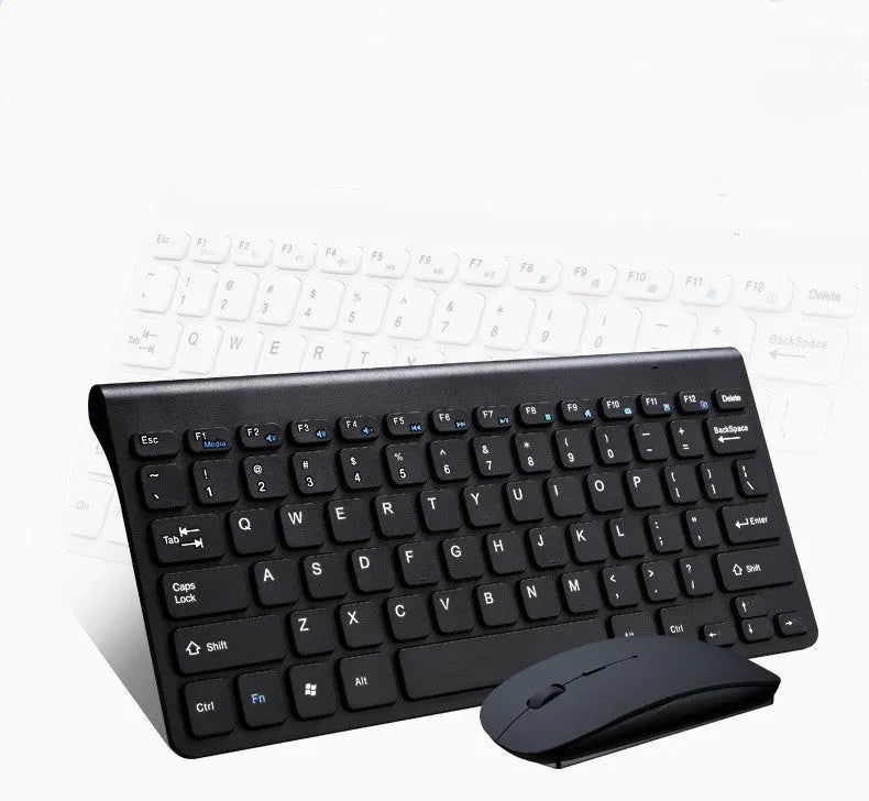 Black and white wireless keyboard and mouse set on a wooden desk.