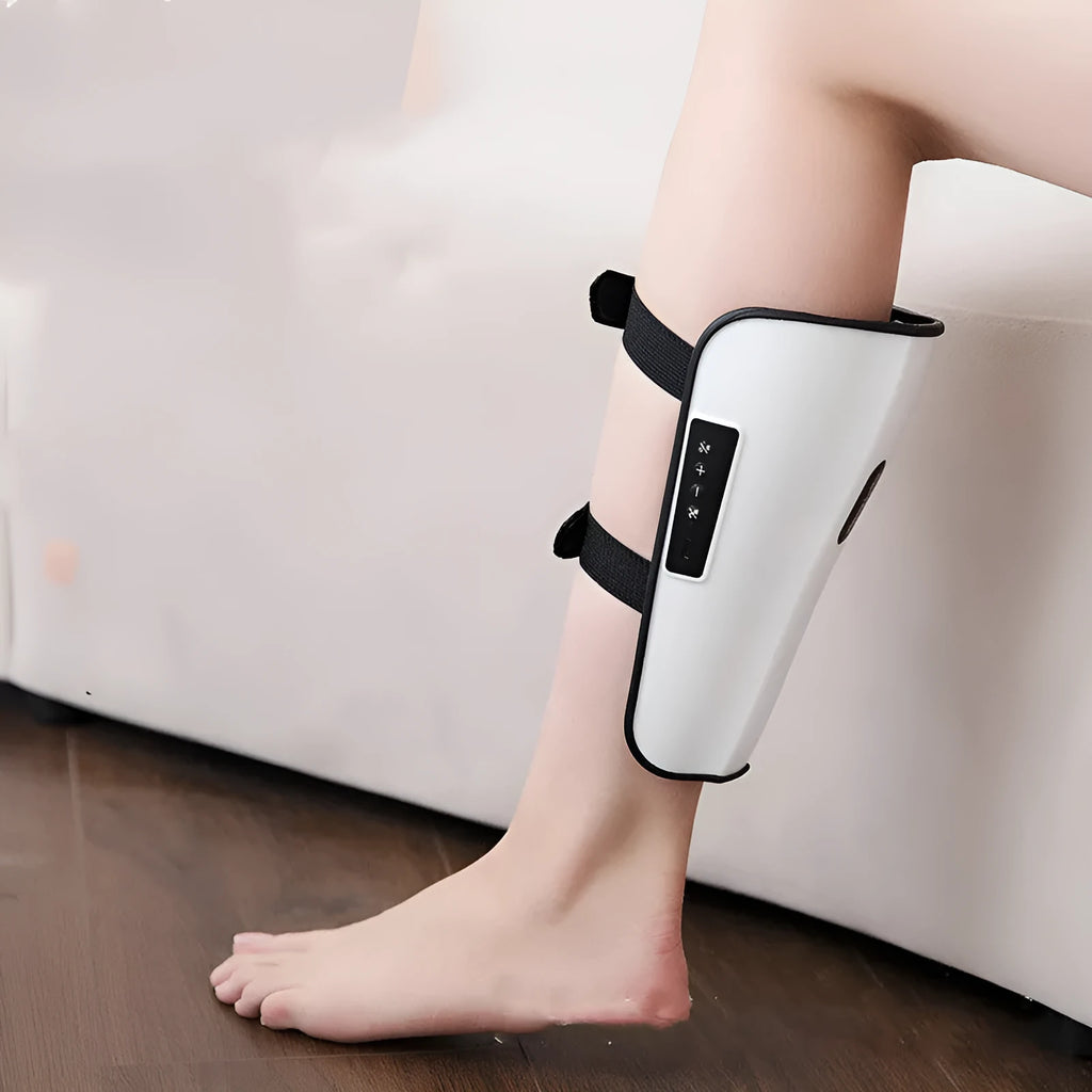 White plastic portable calf massager with electrotherapy pulse and infrared functions.