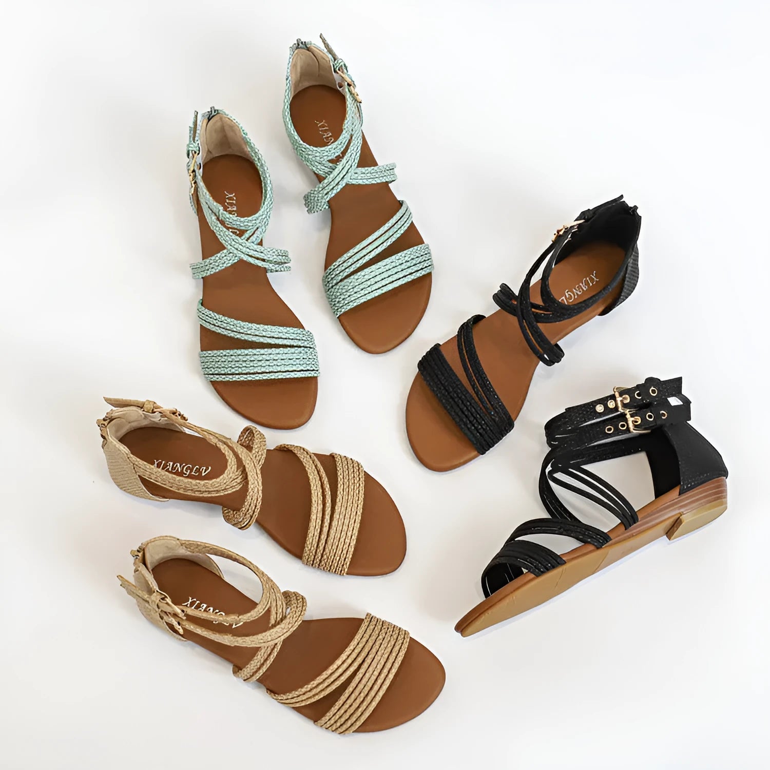 Women's black open toe Roman sandals with cross straps, wedge heel, and back zipper.