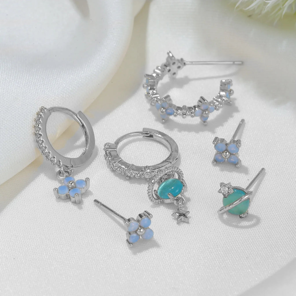 Gold and silver flower-shaped ear studs with zircon mosaic accents in Japanese Korean style
