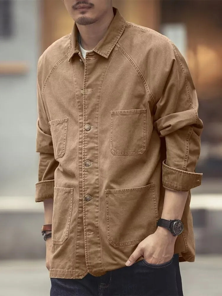 Men's khaki cotton blend denim jacket with loose fit and multiple pockets on a plain background