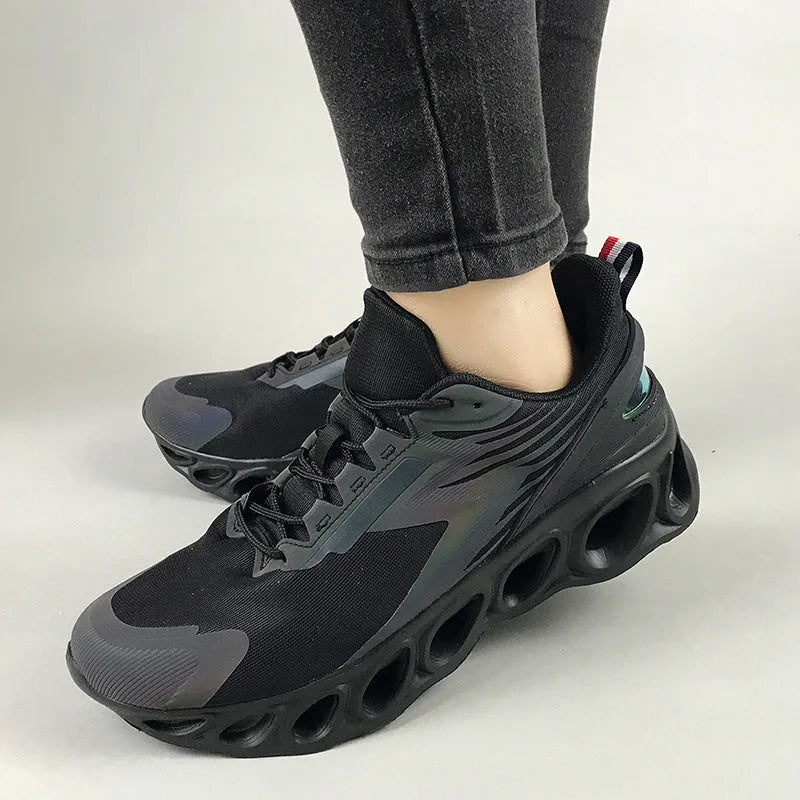 Men's low-top casual sports shoes in mesh with lace-up front and EVA sole, shown in black colour.