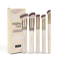 Apricot coloured MAANGE angled blush brush and 4-piece makeup brush set on white background
