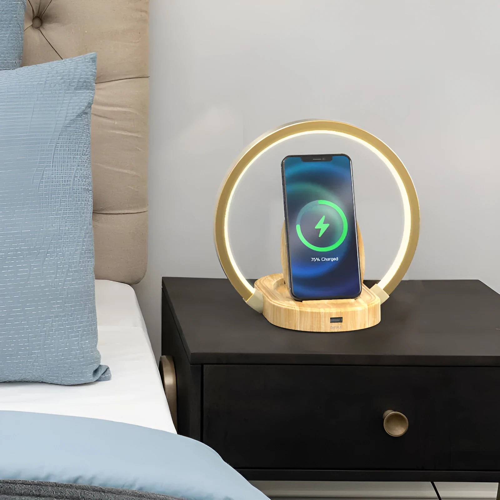 Wood grain wireless charging lamp with Bluetooth speaker, 10W charger, USB port, and phone holder on a desk