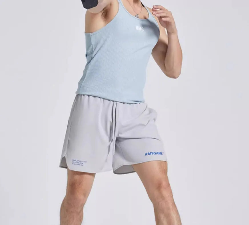 Men's navy blue training fitness shorts made from polyester spandex fabric, shown on a model.