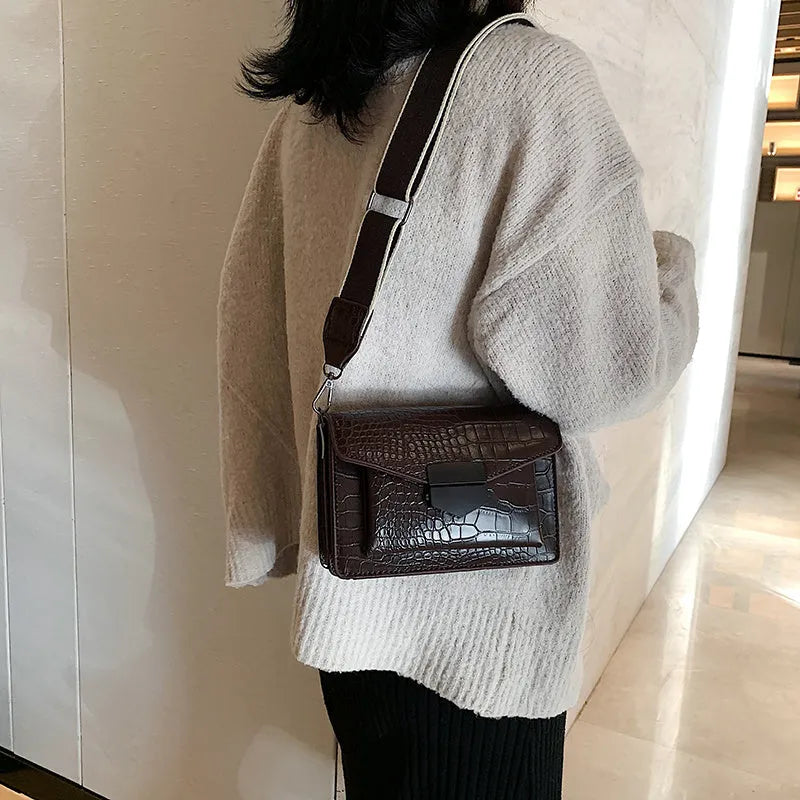 Vintage-style crossbody bag in PU material showing black, brown, khaki and red colour options