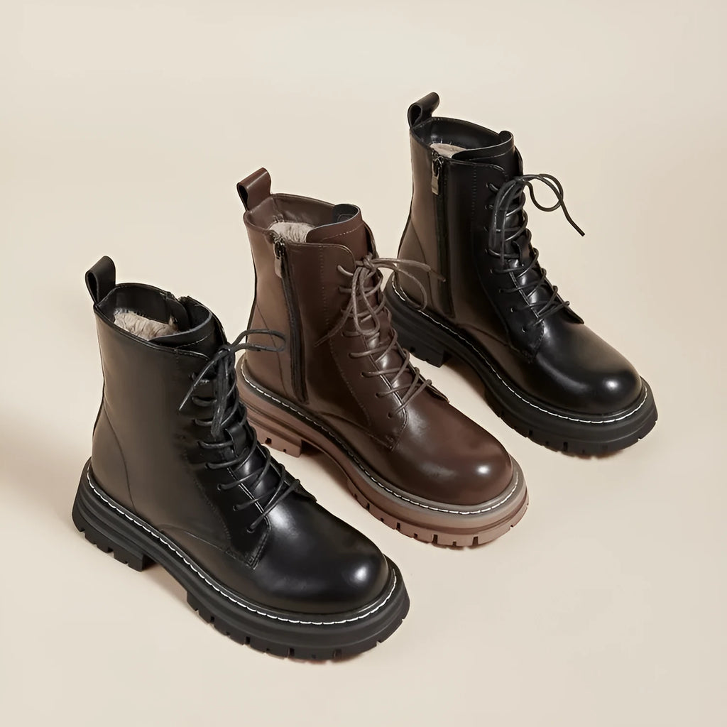 Retro British style platform ankle boots with front lace-up, horseshoe heel, and visible stitching in black