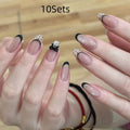 Pack of sweet pastel coloured press-on false nails for girls on a pink background.