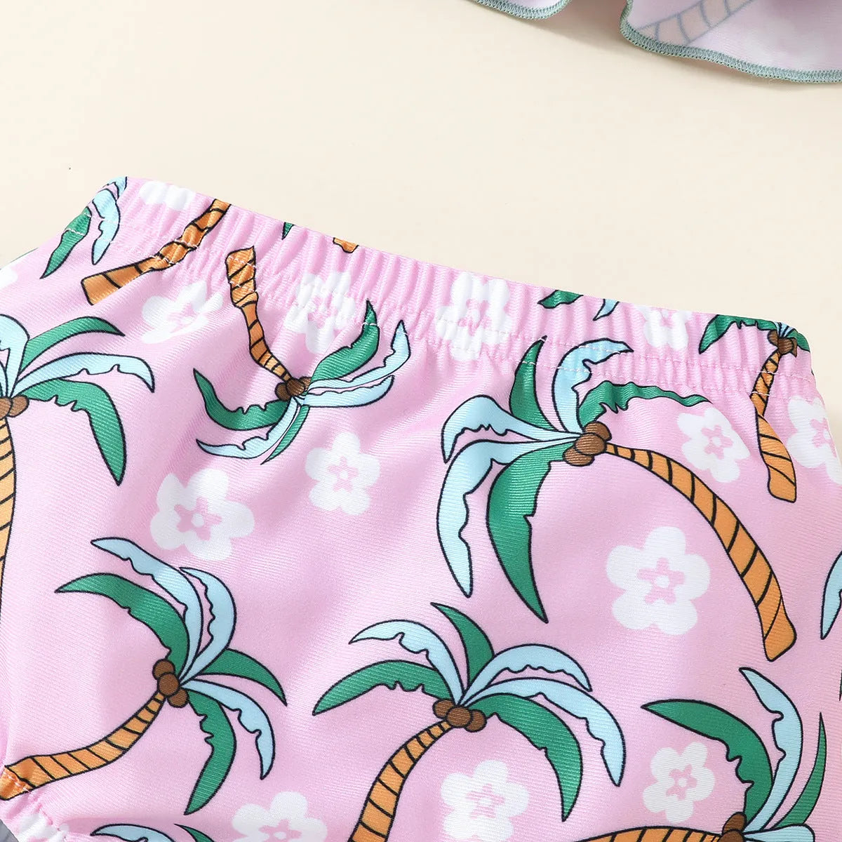 White children's two-piece swimsuit set with shirt and beach shorts for toddlers.