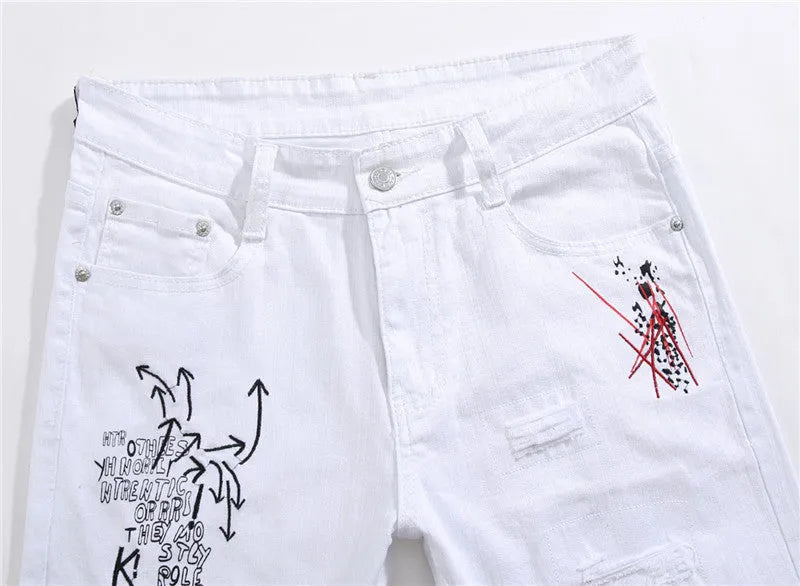 White shredded embroidery jeans in cotton denim, sizes 29-38, with ripped and embroidered details.