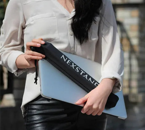 Black reinforced nylon folding laptop stand shown open in use and collapsed for storage.