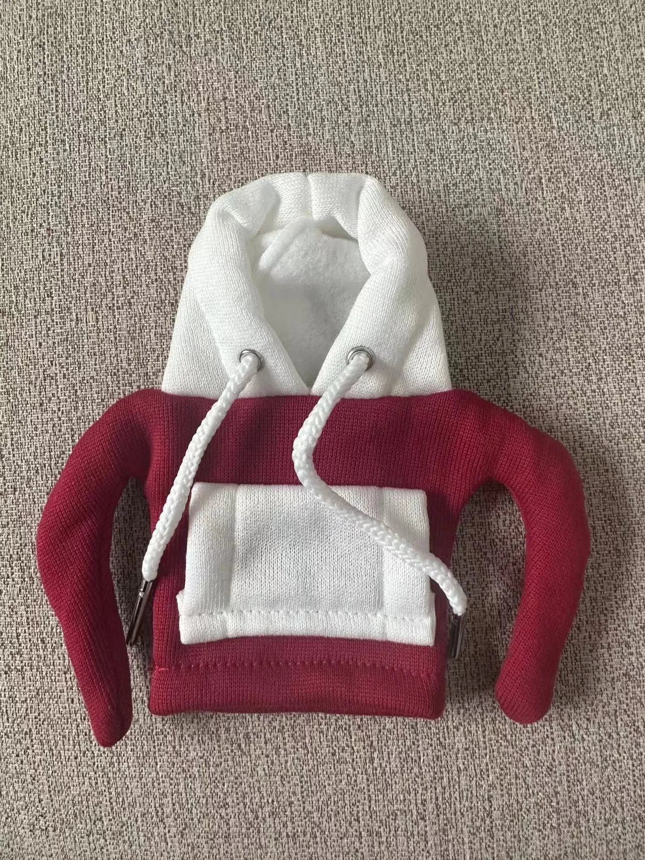 Polyester knit hooded cover stretched over a car manual gear lever in a red and white colour combination.