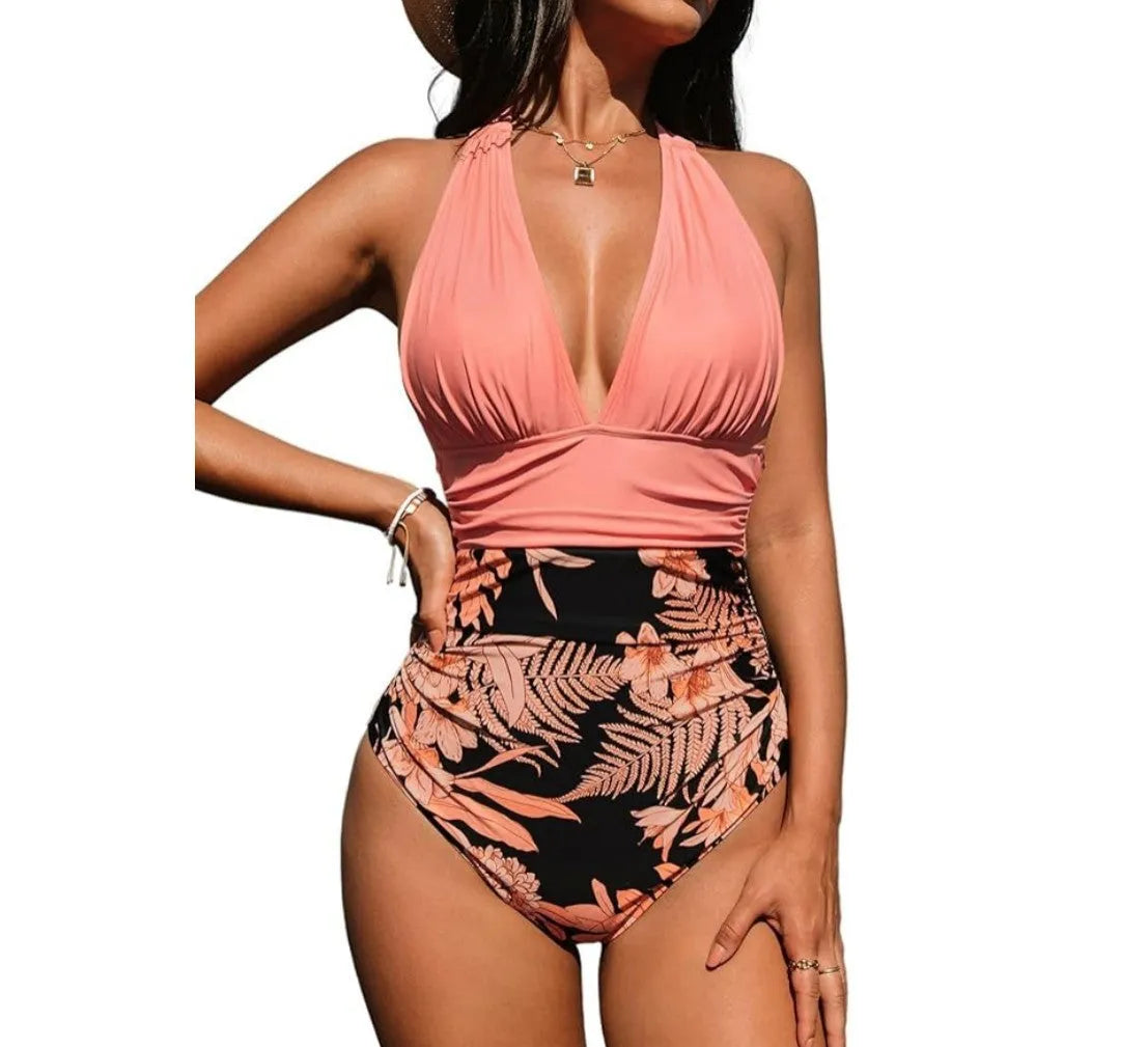 Women's one-piece halter swimsuit in pink floral and leopard print patterns featuring a backless design for swimming.
