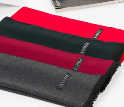 Men's brushed silk winter scarf in black, 180x30cm, lying flat showing texture