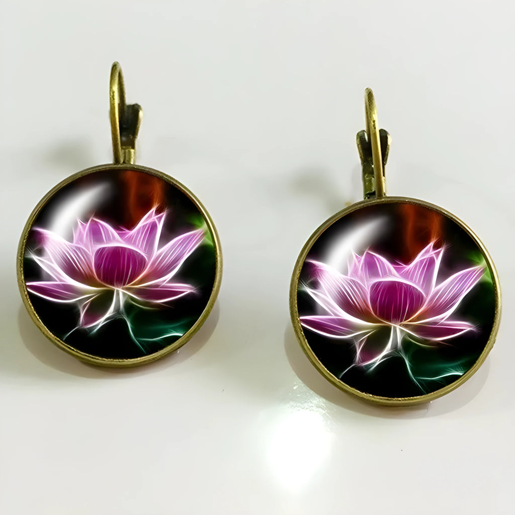 Silver alloy geometric big earring with electroplated gold and sapphire finish on white background
