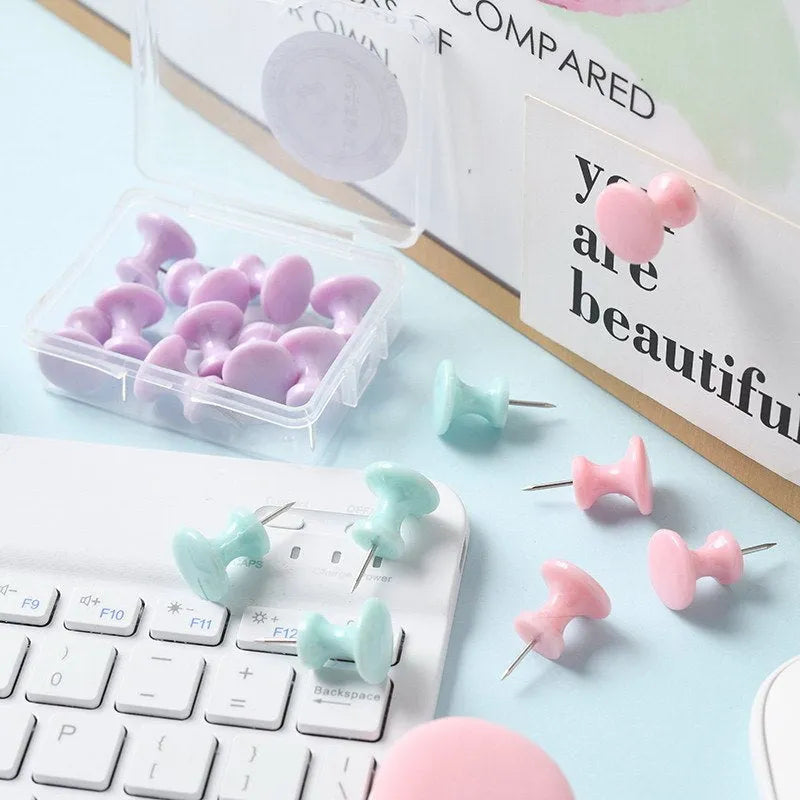 Plastic push pins in cherry blossom pink, mint green, and lavender colours, shown in large and small sizes, packaged in a box.