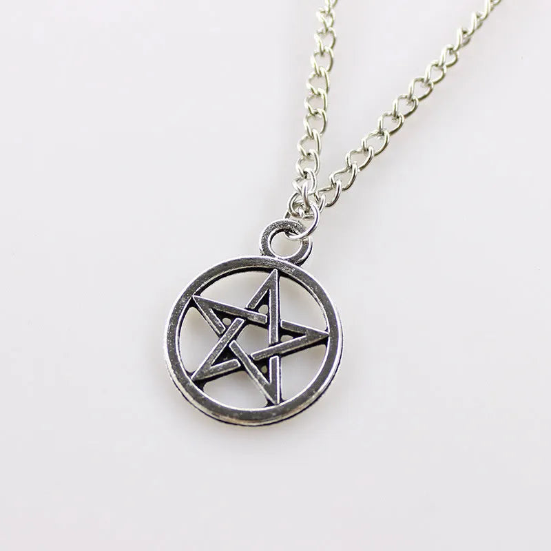 Vintage pentagram necklace with alloy pendant and adjustable chain in bronze colour on neutral background