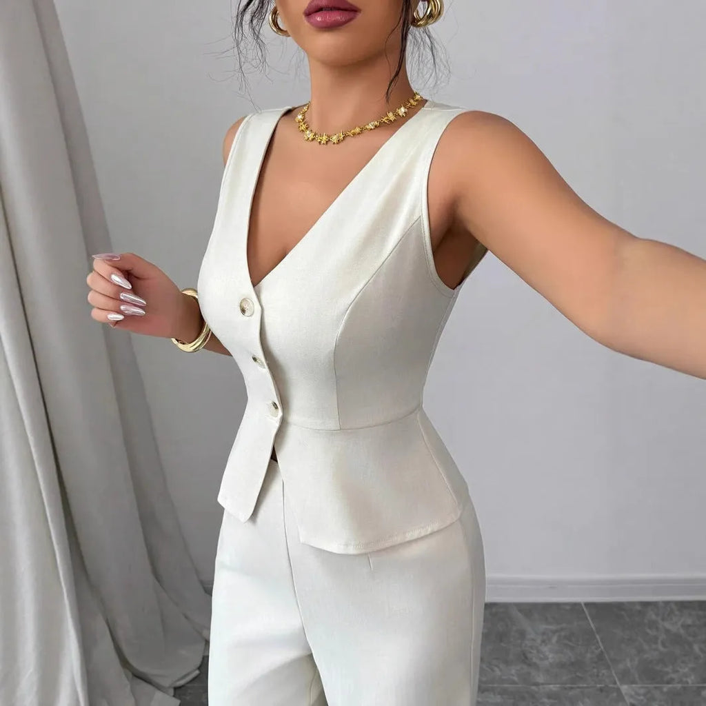 Women's sleeveless vest and high-waist trousers two-piece set in solid colour polyester fabric.