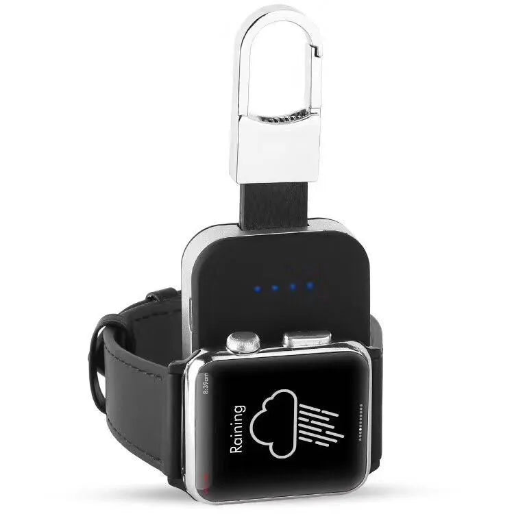 Black keychain-sized wireless power bank for Apple Watch on a keyring.