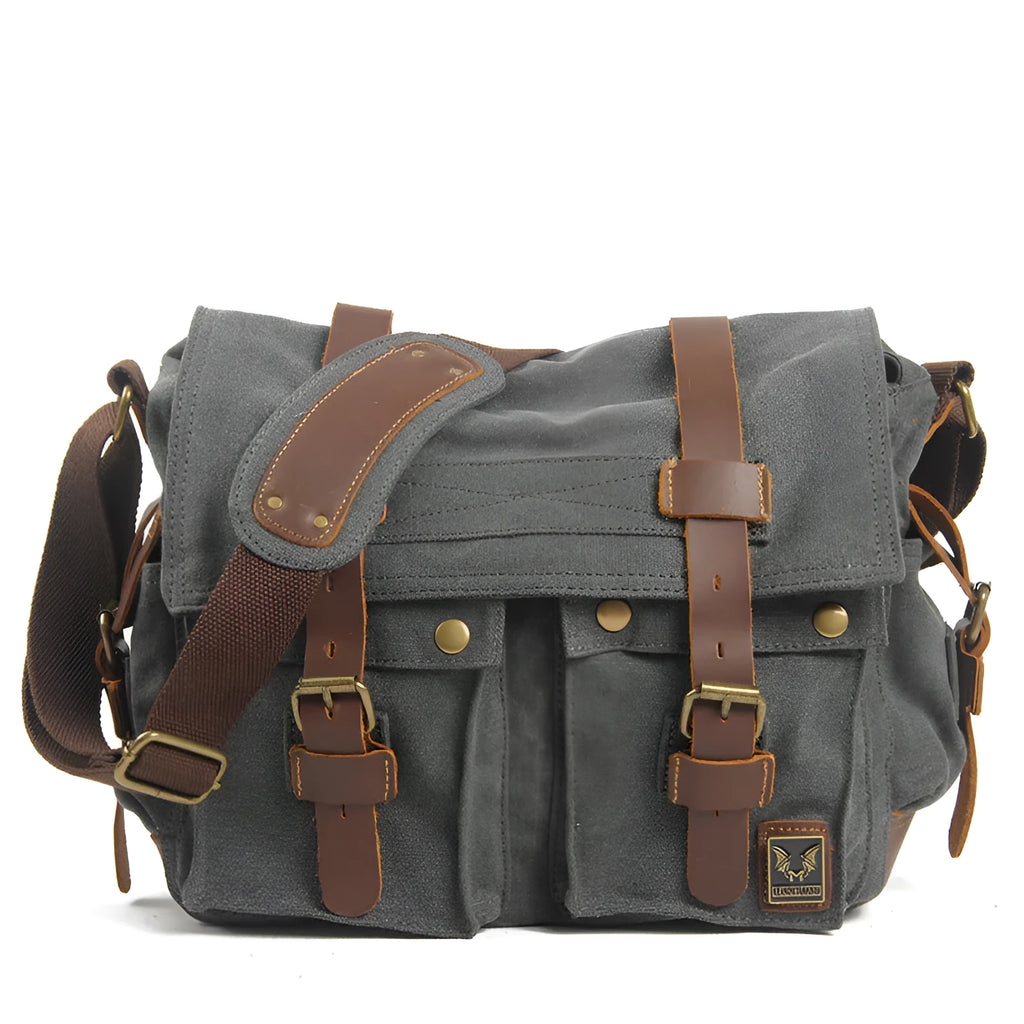 Men's canvas crossbody shoulder bag with cowhide trim in retro styling showing flap closure and single strap