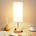 Night Wood Grain table lamp with metal base and three-gear touch dimming on a bedside table