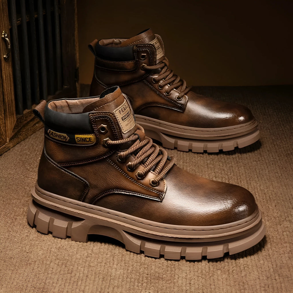 Men's brown round toe Martin boots with lace-up front and a stout heel on a rubber sole.